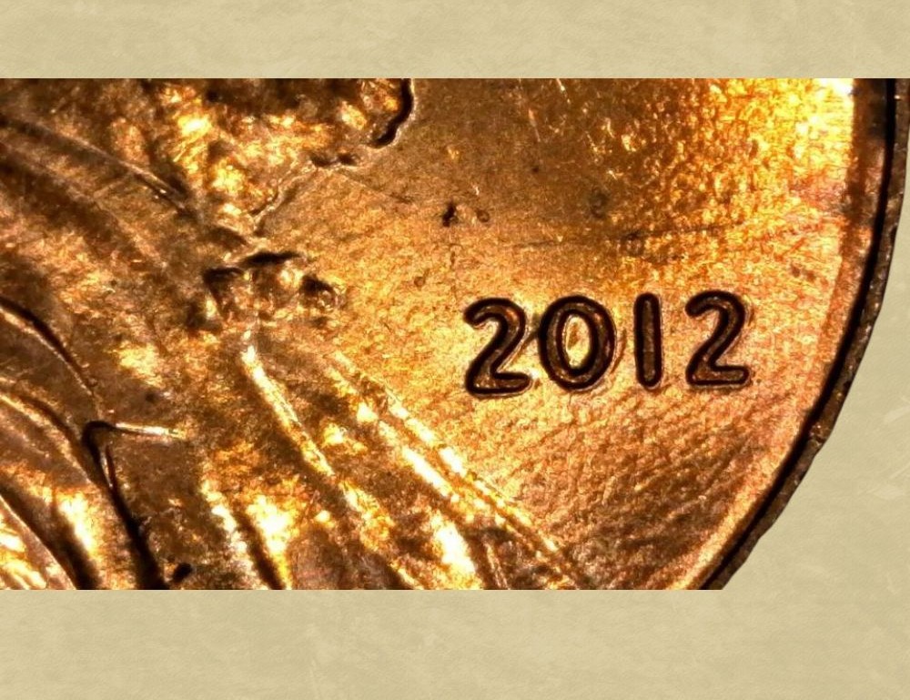 2012 penny Doubled Die Obverse error showing doubling on LIBERTY lettering under magnification