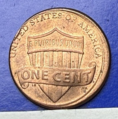 2012 penny off-center strike error showing design shifted with blank crescent and visible date