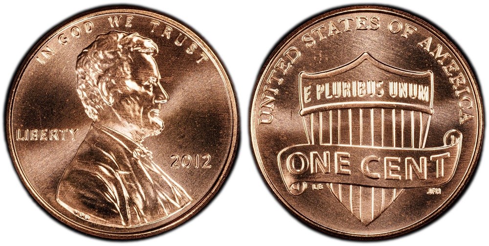 Grading strip showing four 2012 pennies from worn circulated to gem uncirculated MS67 condition